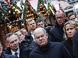 Moment German chancellor Olaf Scholz is heckled by angry mob in Magdeburg as questions remain over 'warnings about Christmas market attack suspect'