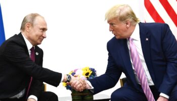 US President Donald Trump (R) attends a meeting with Russia's President Vladimir Putin during the G20 summit in Osaka on June 28, 2019.