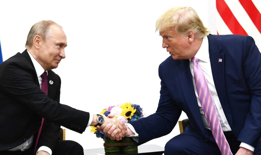 US President Donald Trump (R) attends a meeting with Russia's President Vladimir Putin during the G20 summit in Osaka on June 28, 2019.