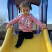 Rafah plays in the park near her new home in Missouri