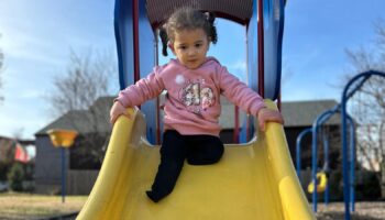 Rafah plays in the park near her new home in Missouri