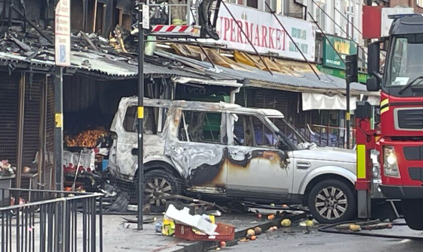 Flats catch fire after car rammed into Birmingham shop in suspected arson attack