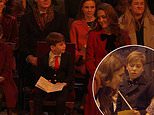 Sweet moment Prince Louis shares comforting words with Kate Middleton at her Christmas carol concert, according to a lip reader - as he excitedly places heartwarming note to his 'granny and grandpa' on 'kindness tree'