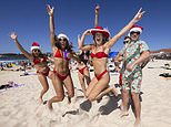 Red hot Christmas: Thousands of bikini-clad revellers embrace the festive season by hitting Bondi Beach