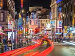 Man is arrested for attempted murder as car rams into Shaftesbury Avenue crowd on Christmas Day leaving four injured including one who is fighting for life 'after nightclub bust-up'