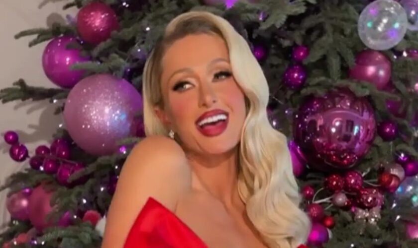 Paris Hilton strips down for racy Christmas photoshoot: ‘My presence is a present’