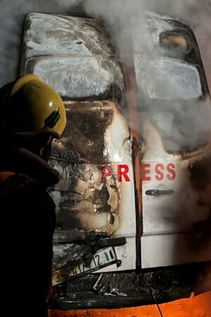 A fire in a broadcast van following an Israeli strike that killed five journalists. Pic: Reuters