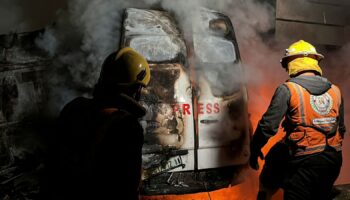 A fire in a broadcast van following an Israeli strike that killed five journalists. Pic: Reuters