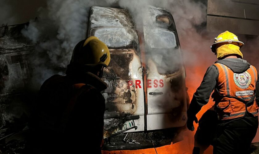 A fire in a broadcast van following an Israeli strike that killed five journalists. Pic: Reuters