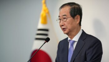 South Korean Prime Minister Han Duck-soo speaks during the joint statements in Seoul, South Korea, Sunday, Dec. 8, 2024, after President Yoon Suk Yeol avoided an opposition-led attempt to impeach him over his short-lived imposition of martial law. (AP Photo/Lee Jin-man)