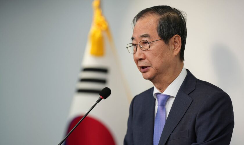 South Korean Prime Minister Han Duck-soo speaks during the joint statements in Seoul, South Korea, Sunday, Dec. 8, 2024, after President Yoon Suk Yeol avoided an opposition-led attempt to impeach him over his short-lived imposition of martial law. (AP Photo/Lee Jin-man)