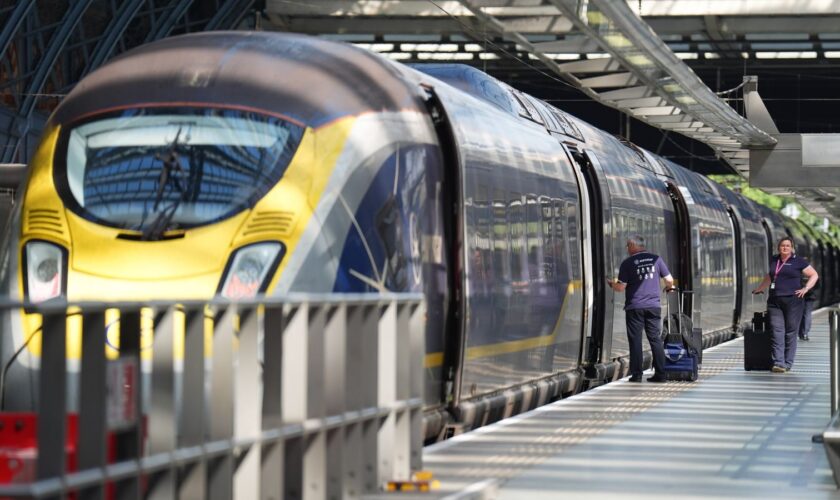 Staff board a train at the Eurostar terminal at St Pancras station in central London. French rail officials say several lines have been hit by "malicious acts" which have heavily disrupted services ahead of the Olympics. Picture date: Friday July 26, 2024.