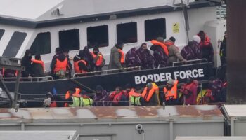 A group of people thought to be migrants are brought in to Dover, Kent, from a Border Force vessel following a small boat incident in the Channel. Picture date: Thursday December 26, 2024. Gareth Fuller/PA Wire