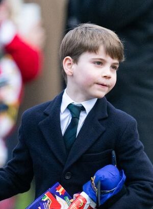 Adorable Prince Louis follows in football-mad dad William's footsteps with Aston Villa shirt