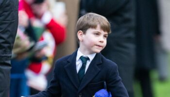 Adorable Prince Louis follows in football-mad dad William's footsteps with Aston Villa shirt