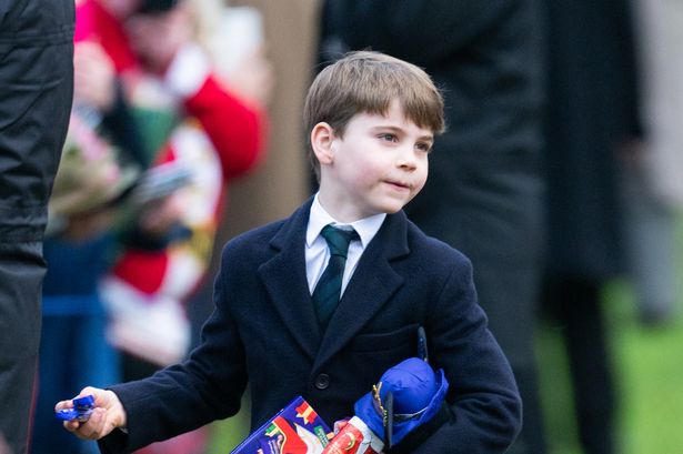 Adorable Prince Louis follows in football-mad dad William's footsteps with Aston Villa shirt