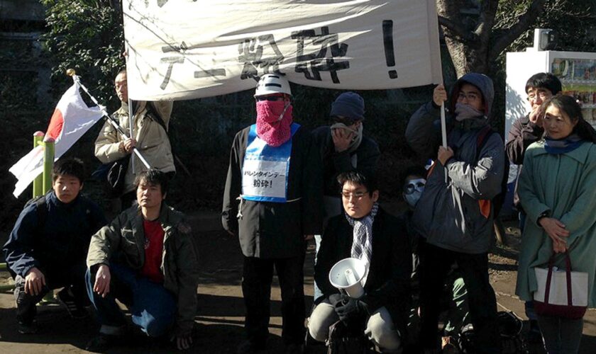 Members of the Revolutionary Alliance of Unpopular Men carry a banner reading "Crush Valentine's Day". File pic: AP