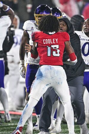 East Carolina-NC State fight mars end of Military Bowl, ref left bloodied