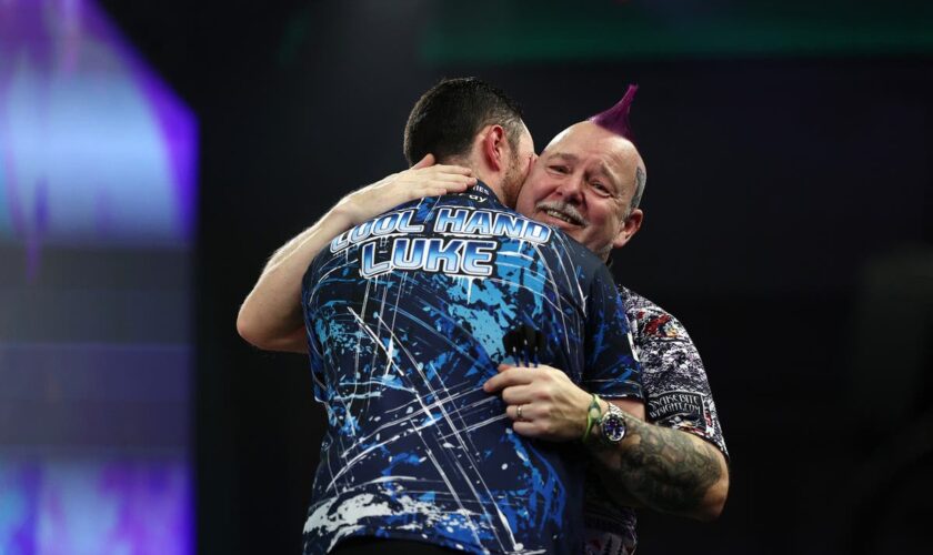 Defending champion Luke Humphries stunned by emotional Peter Wright in major upset