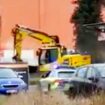 Stolen digger goes on rampage down street as armed police swarm vehicle