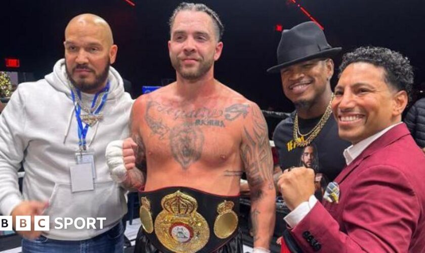 Paul Bamba poses for a photo with manager Ne-Yo after winning the WBA Gold Cruiserweight title