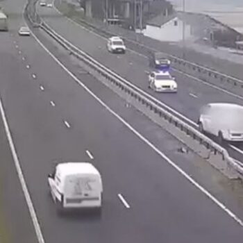 Drunk driver slowly steers his white van head-on into stream of busy traffic