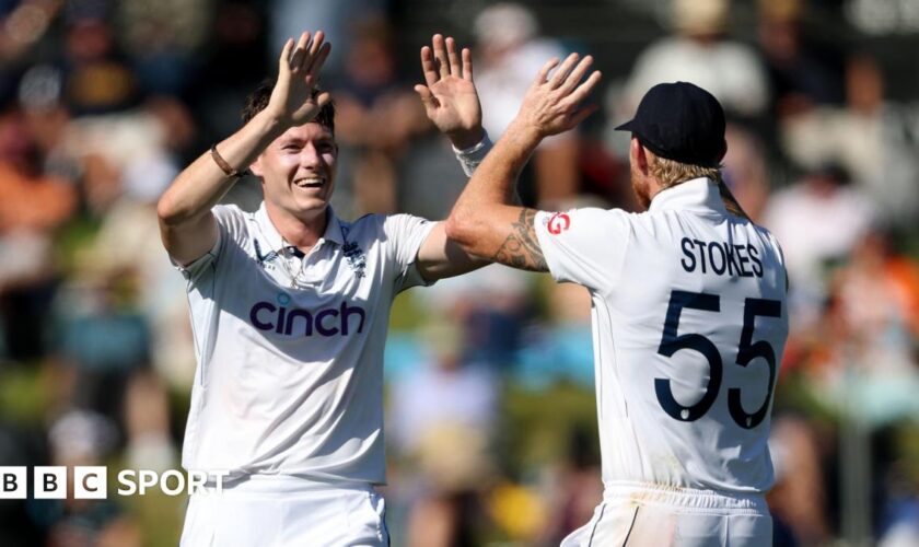 England bowler Matthew Potts (left) celebrates taking a wicket with captain Ben Stokes (right)