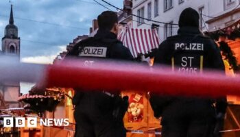 German police probe market attack security and warnings about suspect