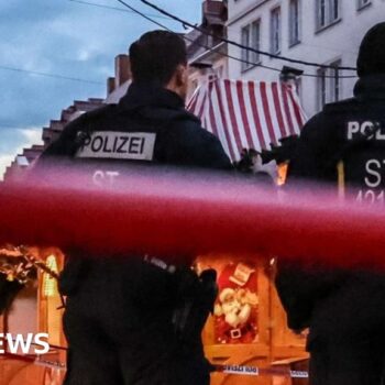 German police probe market attack security and warnings about suspect