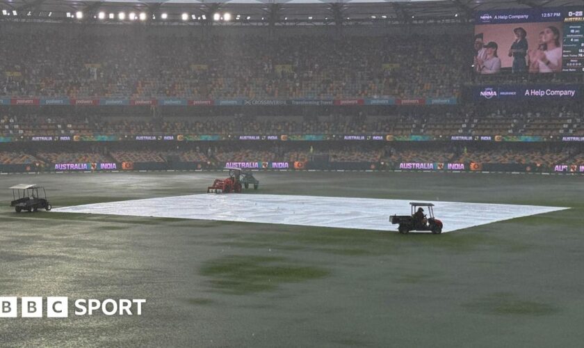 A general view of Gabba as the outfield is covered in puddles