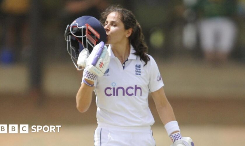 England's Maia Bouchier kisses the badge on her helmet after reaching a century on her Test debut against South Africa