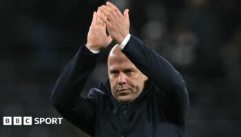 Liverpool Head Coach Arne Slot acknowledges the fans at the end of the emphatic victory at Spurs