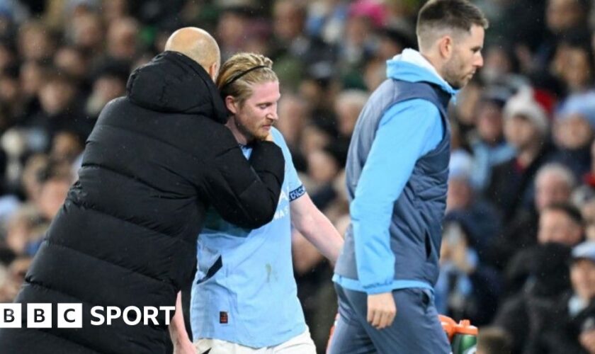 Manchester City's Kevin de Bruyne is hugged by manager Pep Guardiola after being substituted during the 3-0 win against Nottingham Forest