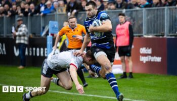 Will Muir skips over a tackle to score a try for Bath