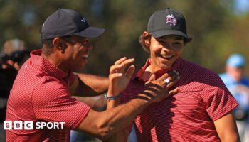 Tiger Woods of the United States reacts with his son Charlie Woods after holing out on the fourth hole during the second round of the PNC Championship at Ritz-Carlton Golf Club in Orlando, Florida