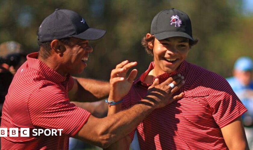 Tiger Woods of the United States reacts with his son Charlie Woods after holing out on the fourth hole during the second round of the PNC Championship at Ritz-Carlton Golf Club in Orlando, Florida