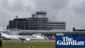 Two men charged over Manchester airport disturbance involving police