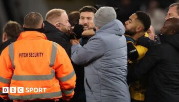 Matheus Cunhas appears to snatch a pair of glasses off the face of a member of Ipswich's security team