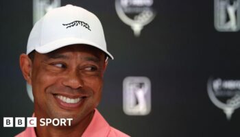 Tiger Woods smiles