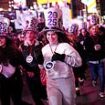 New Year's Eve washout as thousands brave freak lightning storm and torrential rain to welcome in 2025 at NYC's iconic Times Square ball drop