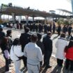 Mourners wait to pay tribute to the victims of a plane fire at a memorial altar at Muan International Airport in Muan, South Korea, Wednesday, Jan. 1, 2025. (Kim Sun-woong/Newsis via AP)