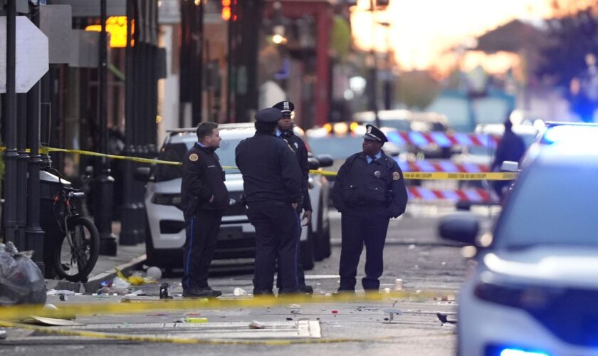 Emergency services attend the scene on Bourbon Street after a vehicle drove into a crowd on New Orleans' Canal and Bourbon Street, Wednesday Jan. 1, 2025. (AP Photo/Gerald Herbert)