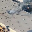 Plane crashes into huge warehouse with multiple 'casualties' reported